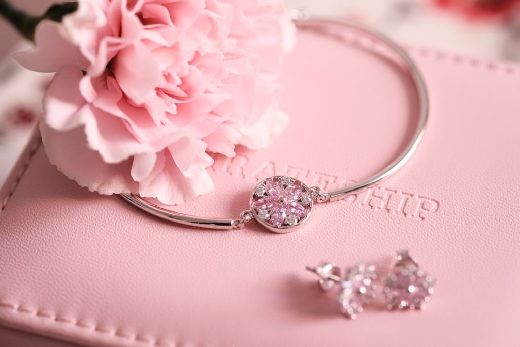 silver-diamond-ring-on-pink-textile-2bxli6tovlo